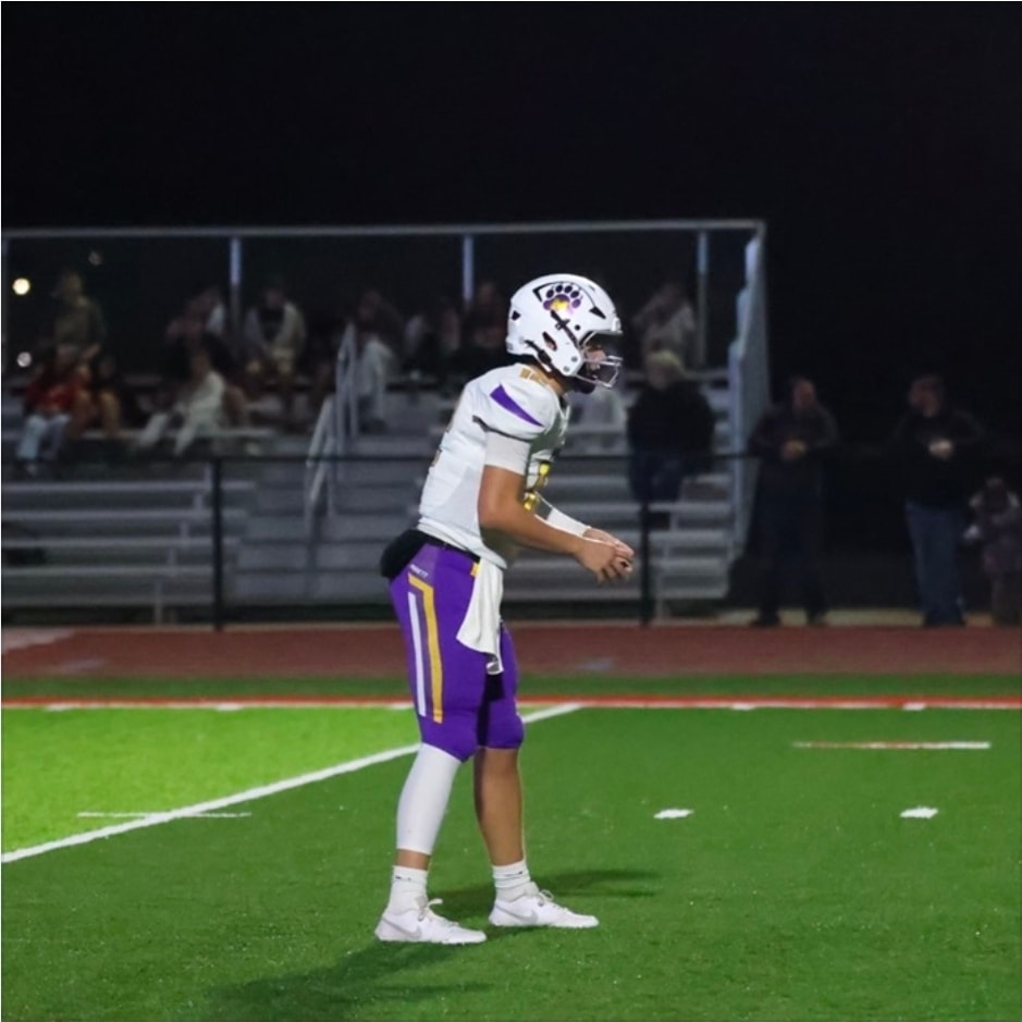 Dylan Washick, Monett Cubs quarterback, on the field during a night game