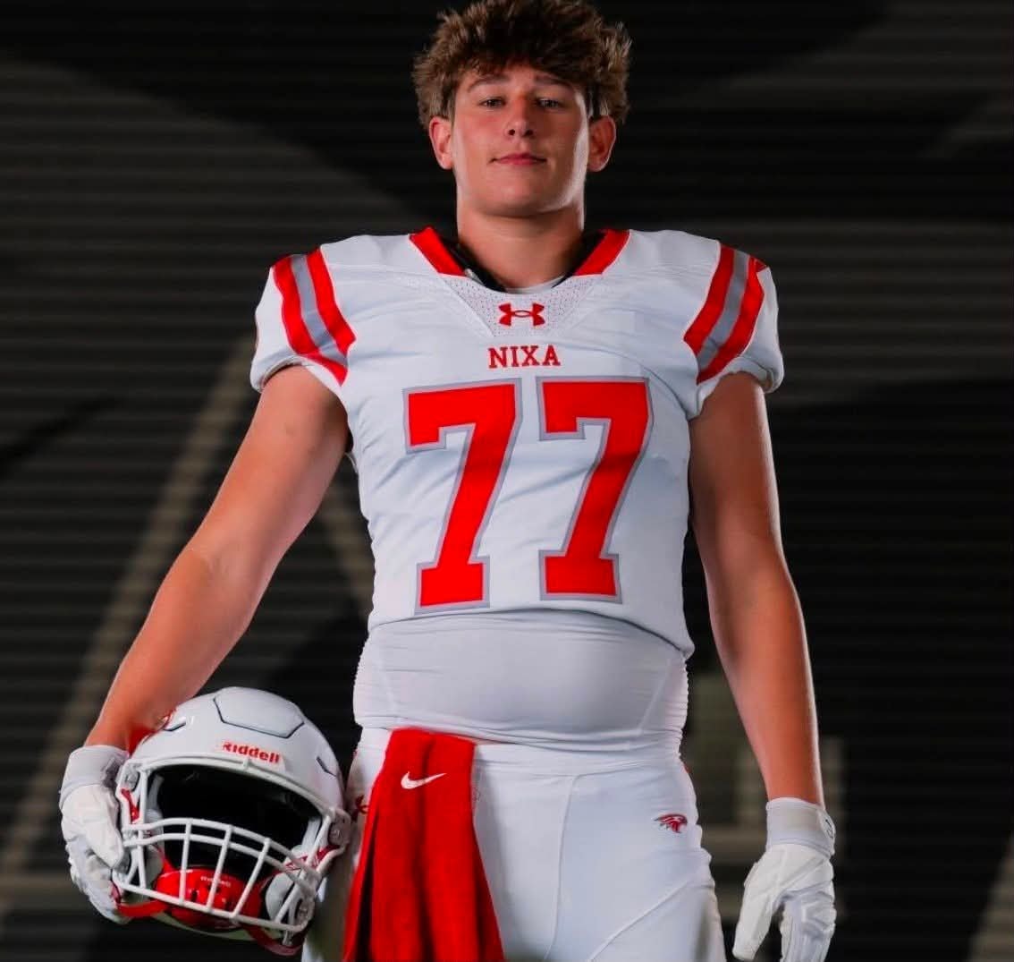 Eli Deal, Nixa Eagles #77, in uniform holding his helmet